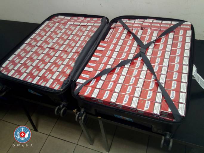 16,000 contraband cigarettes were found in each of the two luggage cases